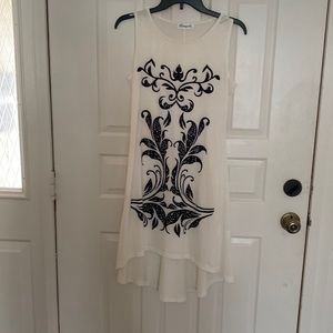 Dress white with black design on front - looks great on!